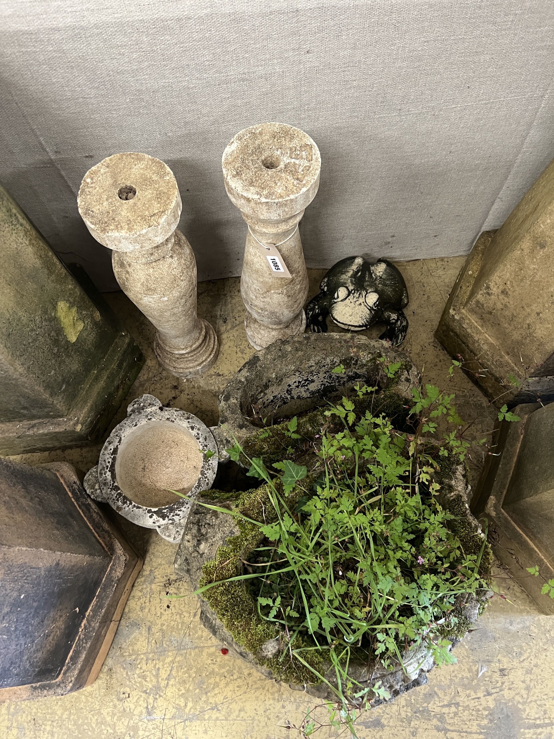 A reconstituted stone rustic branch garden planter, a pair of baluster columns, mortar and a toad